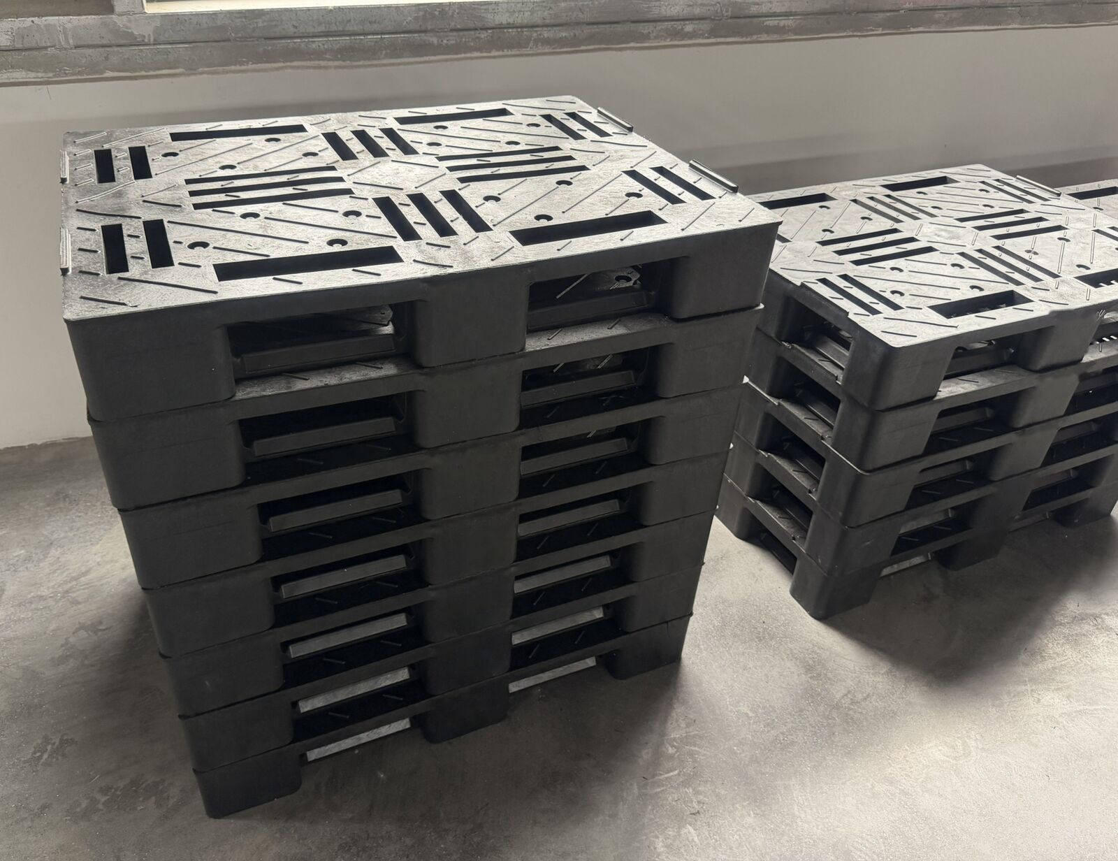 Stacked Polypallet recycled plastic pallets